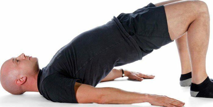 Performing the bow exercise by a man to improve potency